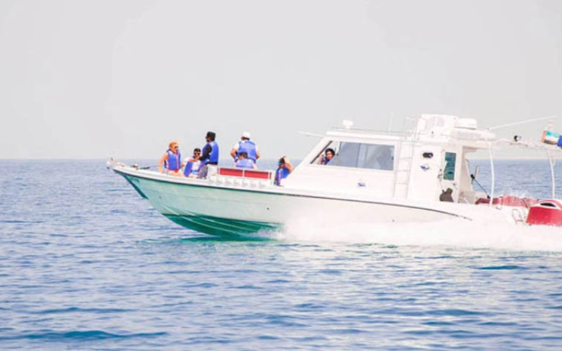 Front view of 33ft Cruiser Yacht sailing in Dubai – yacht rental Dubai by Mala Yachts