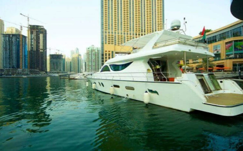 Al Wasmi Yacht cruising past Dubai skyline – yacht rental Dubai by Mala Yachts