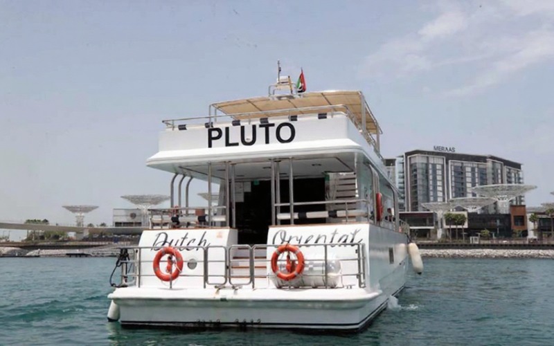 Backside view of Pluto Yacht docked at marina – yacht rental Dubai | Mala Yachts