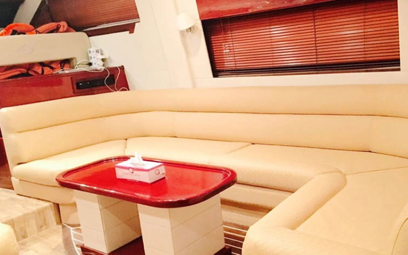 Main salon of Riva Yacht 50 with open-plan layout, designer sofas, full-length windows, and modern Italian décor