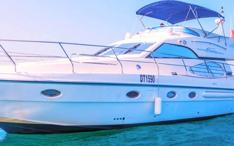 Riva Yacht 50 slicing through the waves with a metallic silver hull, sleek aerodynamic lines, and tinted windshield