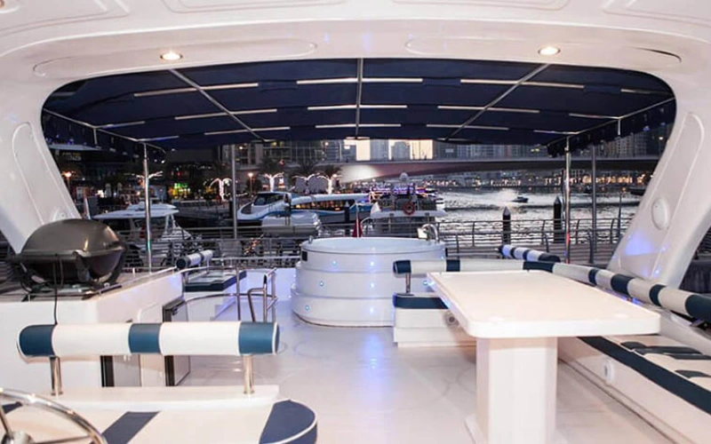 Elegant indoor lounge with plush sofas – yacht rental Dubai | Mala Yachts