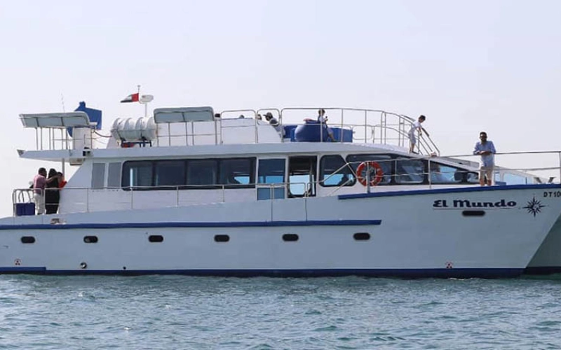 El Mundo Yacht docked by Dubai skyline – yacht rental in Dubai by Mala Yachts