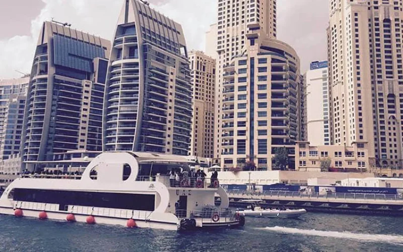 Mona Lisa Yacht cruising near Dubai skyline – Mala Yachts yacht rental in Dubai