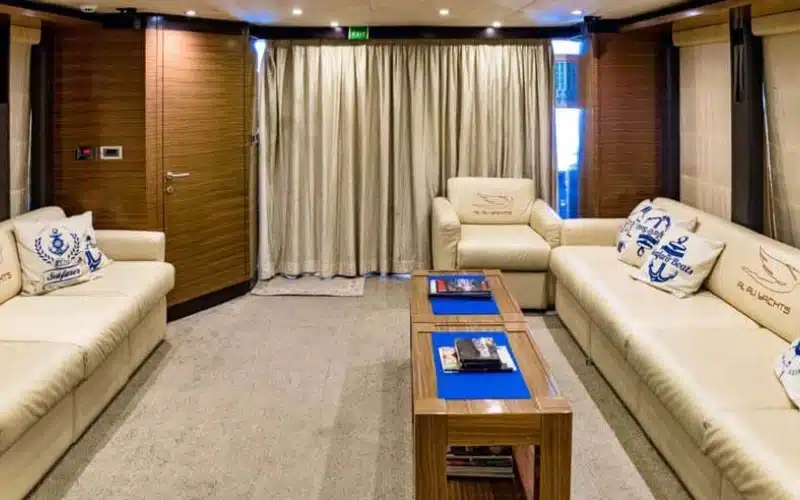 Indoor dining setup on 77ft yacht – yacht rental Dubai by Mala Yachts