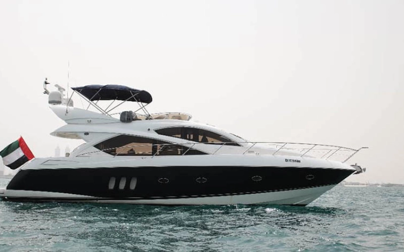 Daydream Yacht anchored by the Dubai skyline – yacht rental Dubai by Mala Yachts