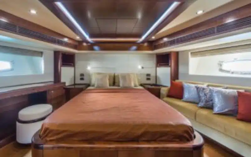 "Guest bedroom with modern design on Majesty Emerald 88 – premium yacht rental in Dubai experience."