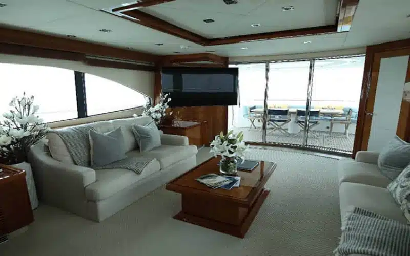 Plush sofa seating area inside Notorious Yacht – yacht rental in Dubai by Mala Yachts
