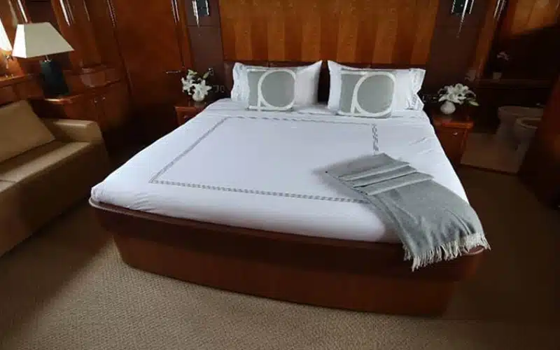 "Spacious bedroom on Notorious Yacht – perfect for overnight yacht rental in Dubai by Mala Yachts."