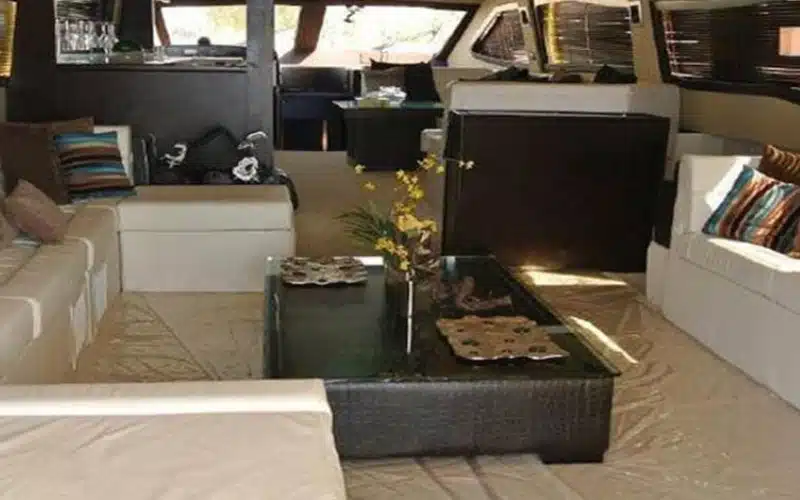 Cozy sofa seating in Al Khan Yacht lounge – yacht rental Dubai with Mala Yachts
