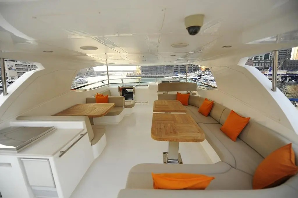 "Elegant dining room in 101 Feet Yacht – premium interior for yacht rental in Dubai with Mala Yachts."