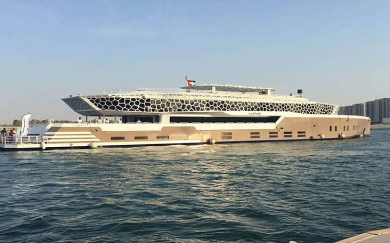 Evening view of Lotus Mega Yacht exterior – luxury yacht rental Dubai with Mala Yachts.