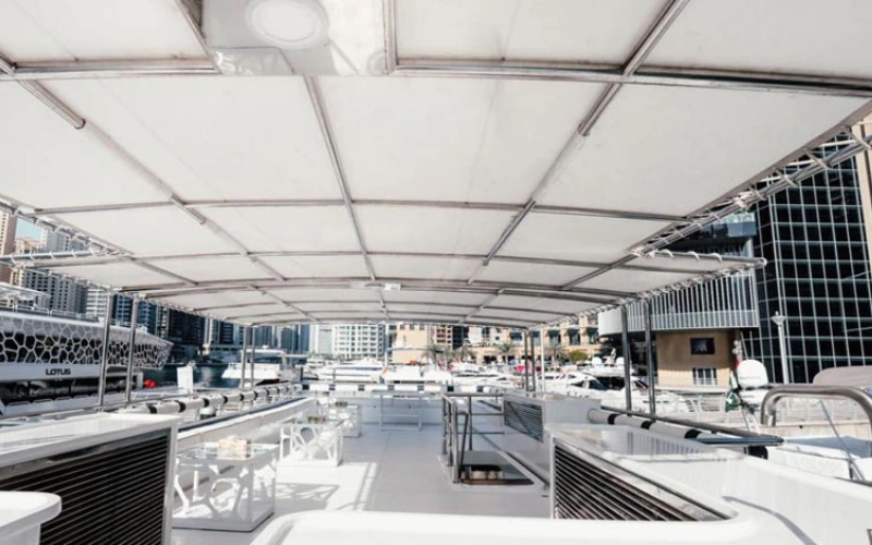 Spacious outdoor lounging area on Venus Yacht perfect for relaxing and sightseeing – elevate your escape with Mala Yachts yacht rental in Dubai