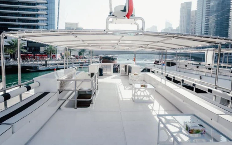 Spacious salon with large windows and stylish interiors – experience luxury on water with Mala Yachts yacht rental Dubai