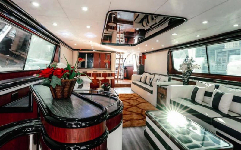 Luxurious salon inside Ocean Pearl Yacht with plush sofas – indulge in premium comfort with Mala Yachts yacht rental in Dubai