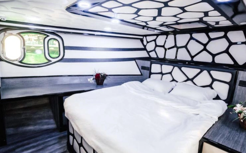 Spacious bedroom aboard Ocean Pearl Yacht featuring modern marine design – ideal retreat with Mala Yachts yacht rental Dubai
