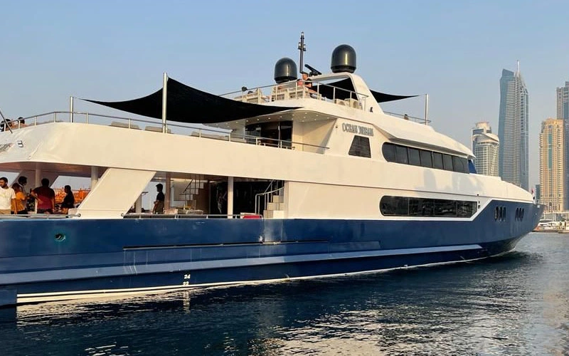 Backside of the 141 Feet Yacht featuring a wide staircase and boarding area – luxurious boarding via Mala Yachts yacht rental Dubai