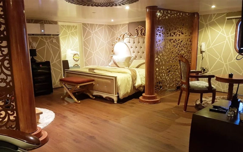 Master bedroom on 141 Feet Yacht with king-size bed and panoramic marine views – offered by Mala Yachts yacht rental in Dubai