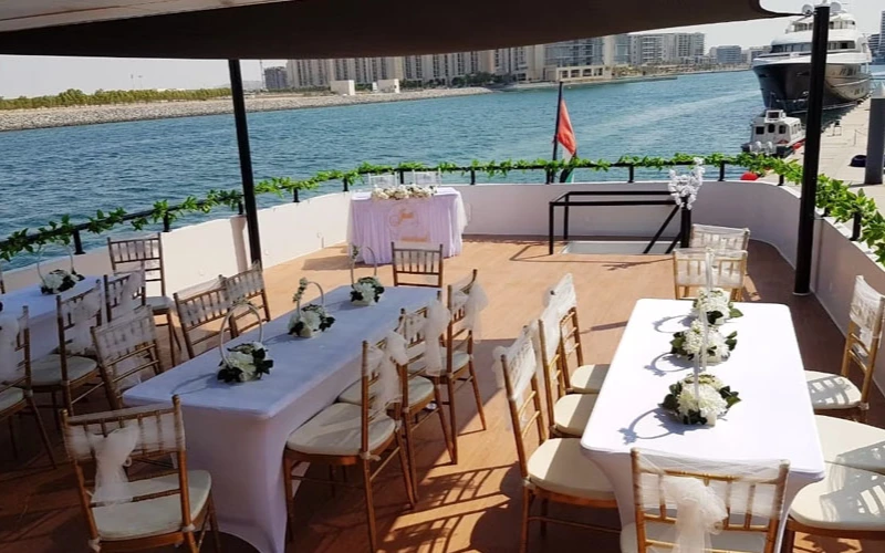 Spacious lounge area on the 141 Feet Yacht with luxurious sofas and ambient lighting – experience comfort with Mala Yachts yacht rental in Dubai