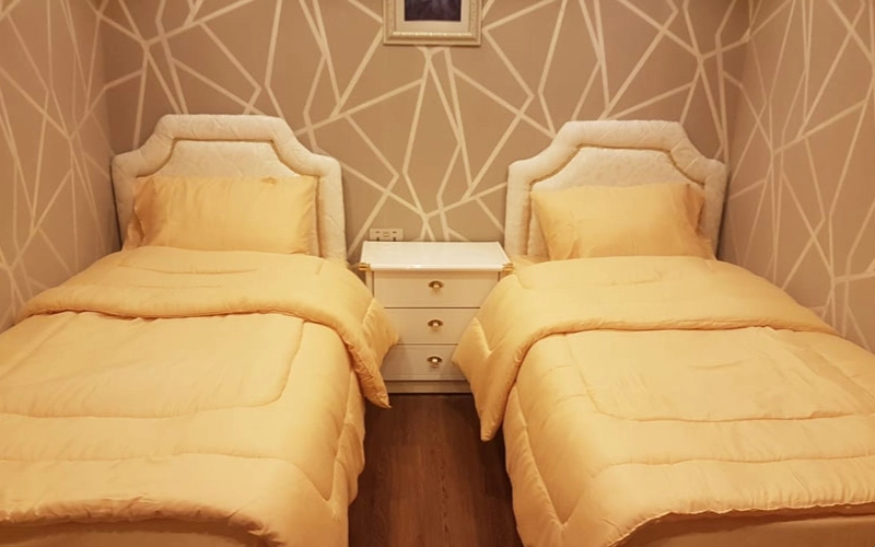 Cozy twin bedroom on the 141 Feet Yacht with modern design and sea views – enjoy restful nights with Mala Yachts yacht rental in Dubai