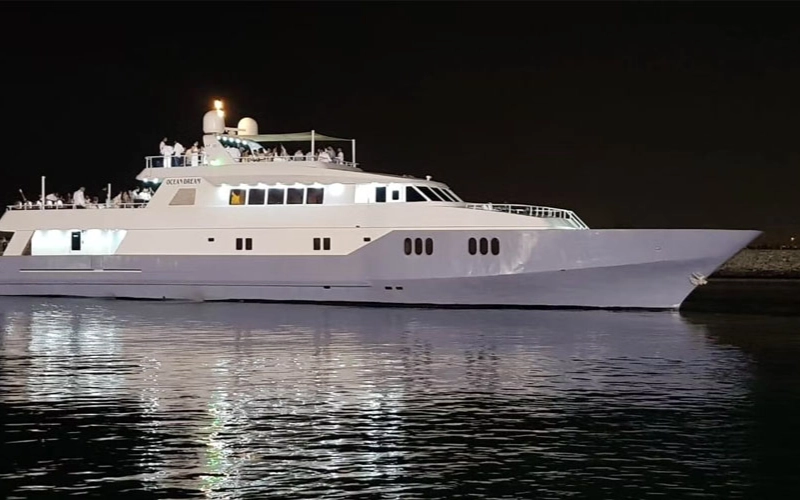 Full side view of the 141 Feet Yacht sailing through Dubai waters – available with Mala Yachts yacht rental Dubai