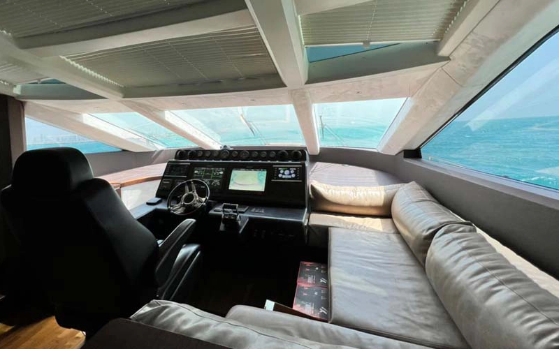 Captain’s control area on the 78 Feet Yacht featuring advanced navigation and panoramic views – part of the luxury experience with Mala Yachts yacht rental in Dubai