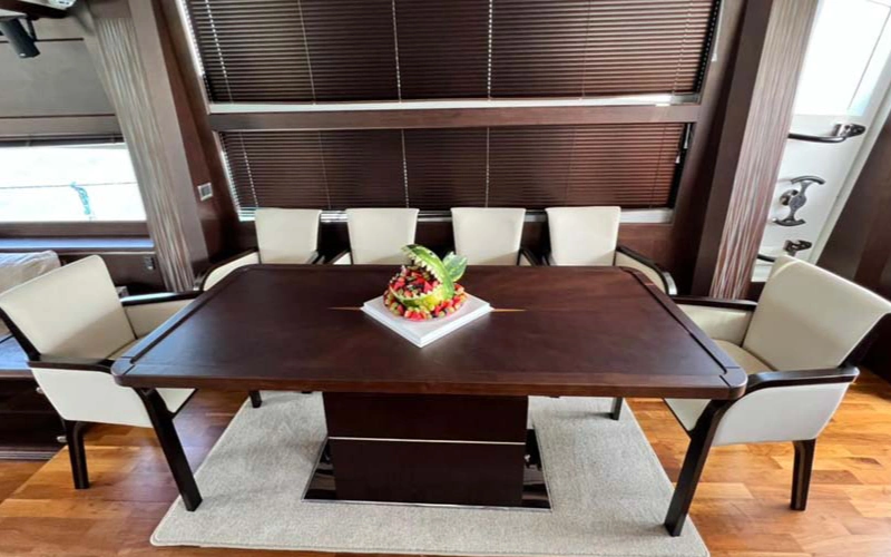 Stylish dining area inside 78 Feet Yacht for private meals at sea – enjoy this comfort with yacht rental in Dubai by Mala Yachts