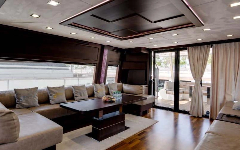 Modern indoor lounge on 78 Feet Yacht with panoramic windows and luxury seating – offered by Mala Yachts yacht rental in Dubai