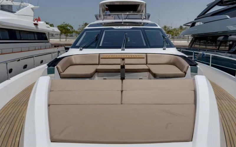 Spacious upper deck of 78ft yacht with open-air lounge and skyline views – part of Mala Yachts yacht rental Dubai service
