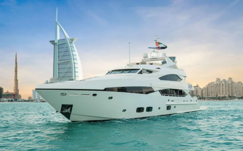 Side view of Lucien 131 yacht cruising along the Dubai coastline – offered by Mala Yachts, leaders in yacht rental Dubai