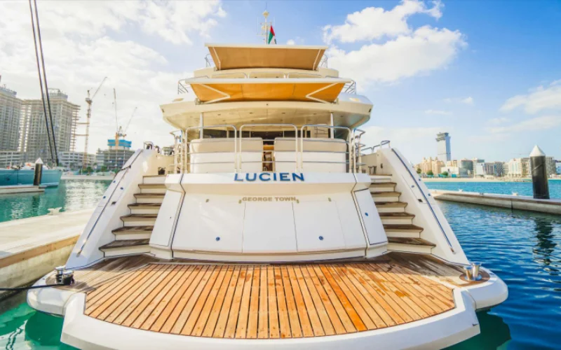 Elegant interior staircase on Lucien 131 yacht connecting multiple decks – featured in Mala Yachts’ luxury yacht rental in Dubai