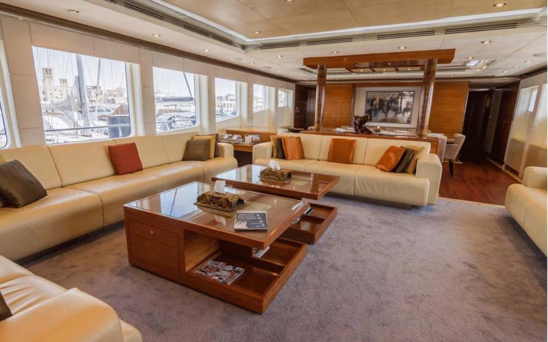 Indoor dining area with panoramic windows on Majesty 121ft – best for luxury yacht rental in Dubai