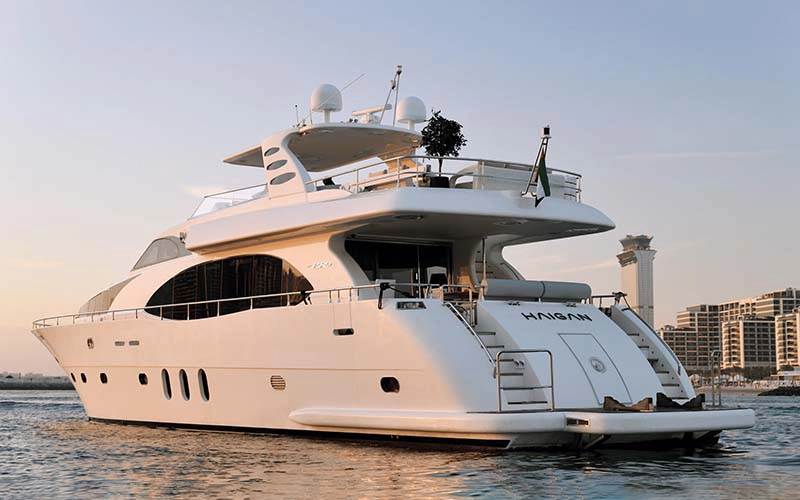 Haigan 90ft yacht cruising near the Dubai Marina skyline – a signature experience from Mala Yachts’ yacht rental in Dubai