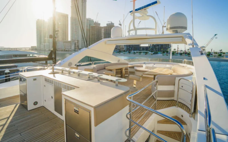 Luxury lounge area inside Lucien 131 yacht featuring plush sofas and modern design – available with Mala Yachts’ yacht rental in Dubai