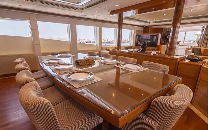 Formal dining space with panoramic ocean views – available with Majesty 121ft yacht rental Dubai by Mala Yachts