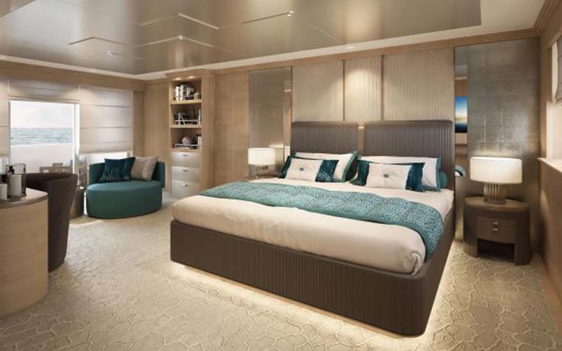 Stylish bedroom cabin on Code 8 yacht featuring cozy bedding and ocean views – a highlight of yacht rental in Dubai by Mala Yachts