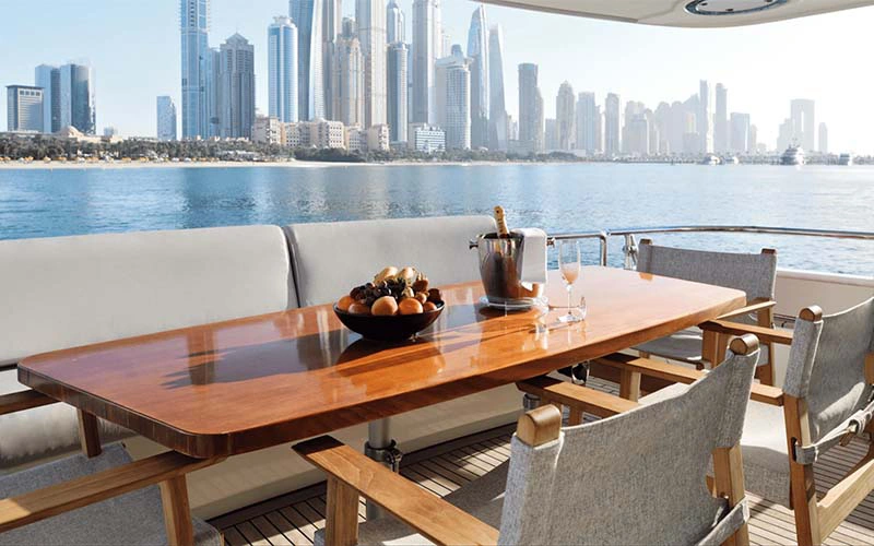 Sun deck on Haigan 90ft yacht with cushioned loungers and ocean views – available with Mala Yachts yacht rental in Dubai