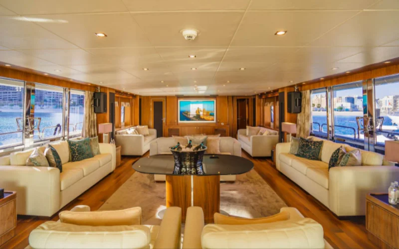 Contemporary indoor dining space on Lucien 131 yacht – exclusive feature of Mala Yachts’ luxury yacht rental in Dubai