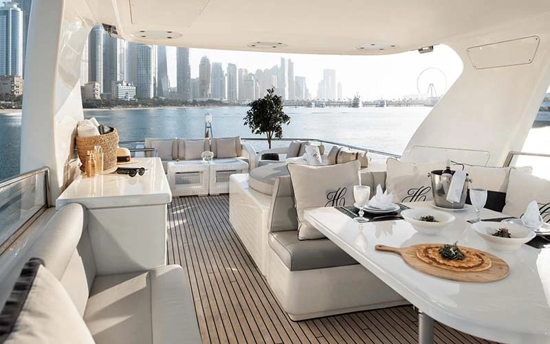 Spacious outdoor seating area on Haigan 90ft yacht perfect for relaxing under the Dubai sky – part of Mala Yachts’ premium yacht rental Dubai experience