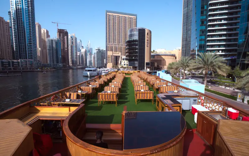 Spacious banquet-style setup inside Ocean Empress Dinner Cruise with formal table arrangements