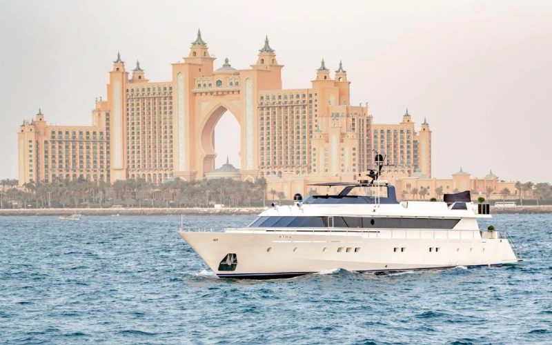 Front bow of 151ft Yacht with sunbeds and stainless steel railings over deep blue waters