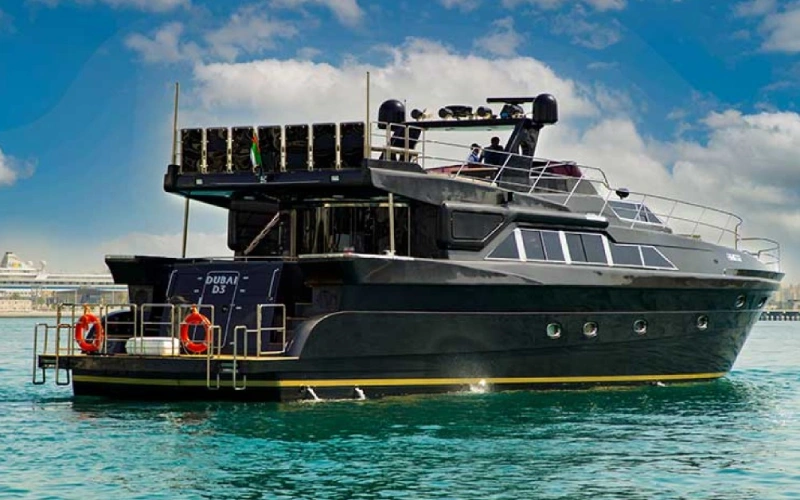 Side profile of Black Beauty Yacht sailing smoothly with a glossy black finish