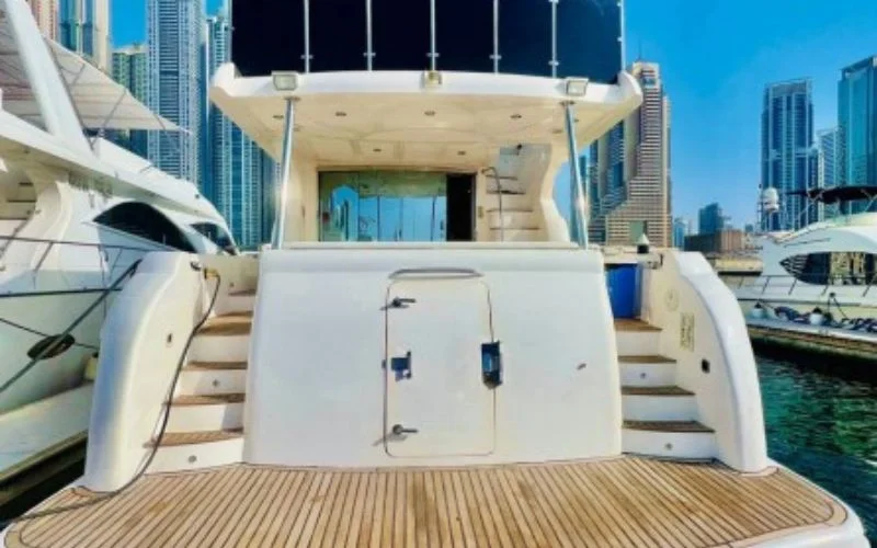 Backside stairs on Majesty 77ft Yacht connecting upper deck to swim platform