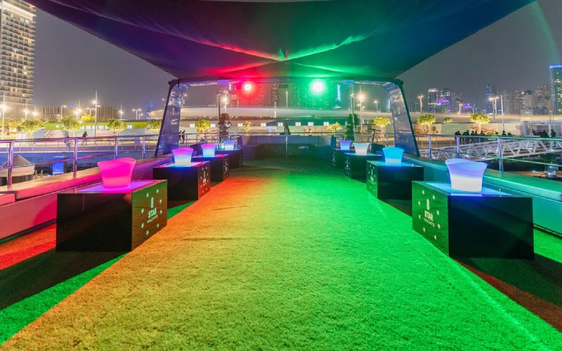 "Spacious indoor lounge on Sweet Caroline Yacht featuring elegant sofas, large windows, and soft ambient lighting"