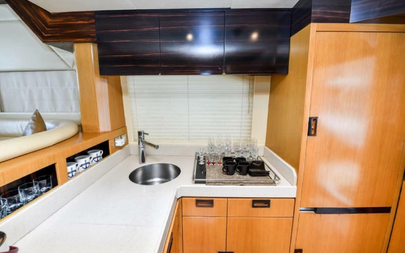 "Modern kitchen on Silver Queen Yacht featuring sleek cabinetry, built-in appliances, and compact luxury design"