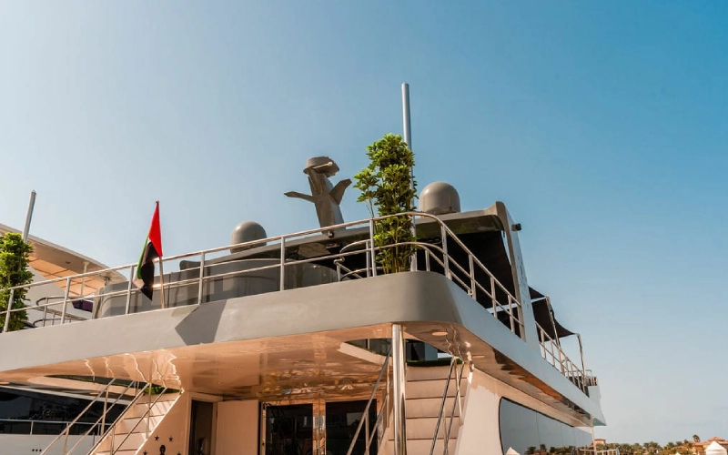 Upper deck of Sweet Caroline Yacht with lounge seating and unobstructed ocean views