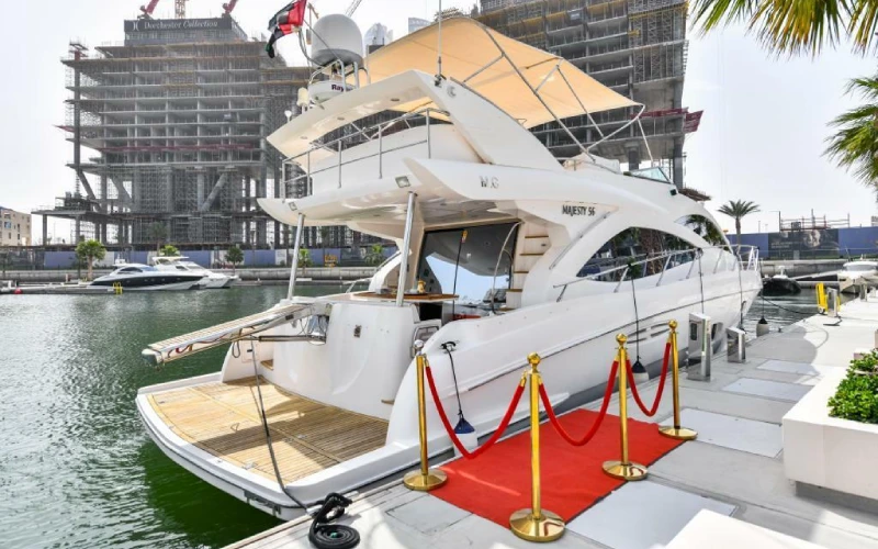 Side view of Silver Queen Yacht cruising on open sea with a sleek and modern design