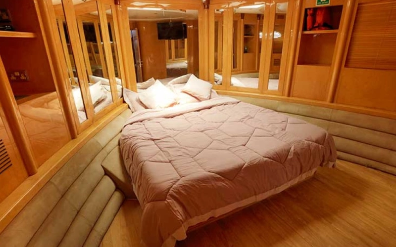 Modern bedroom on Black Beauty Yacht with elegant design and panoramic window