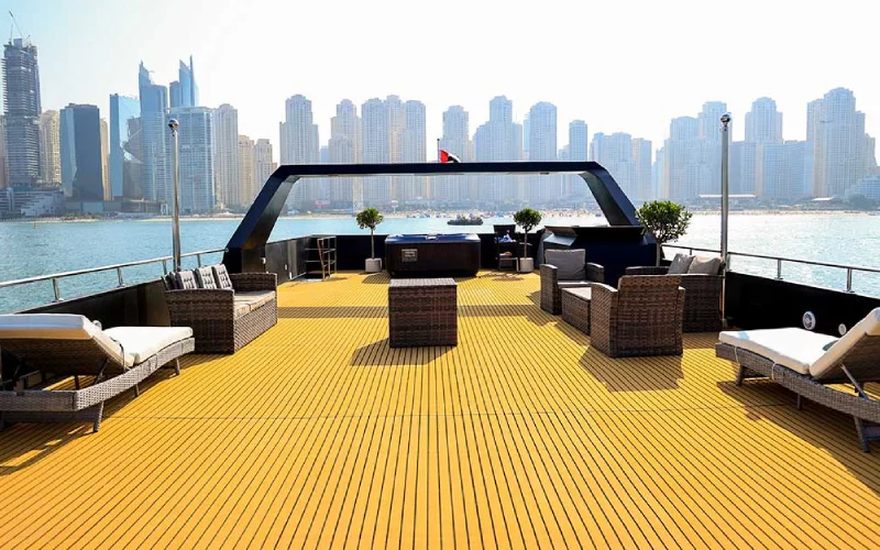 Spacious indoor salon on Playboy 90ft Yacht with luxurious seating, large windows, and modern finishes