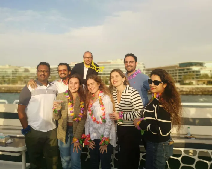 "Friends enjoying refreshments and casual conversations at a corporate gathering."